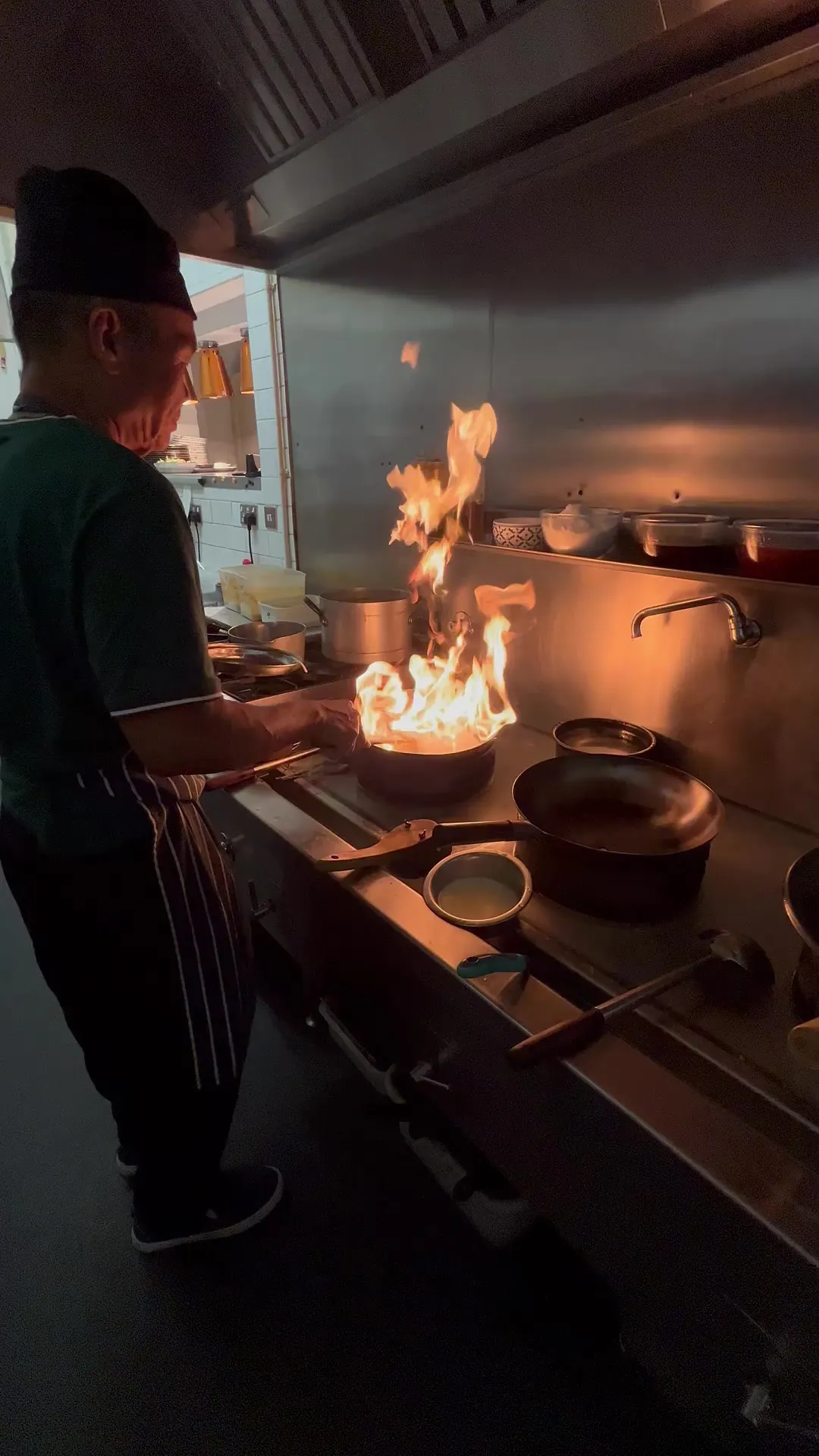 A Namh Moon chef cooking over a high flame